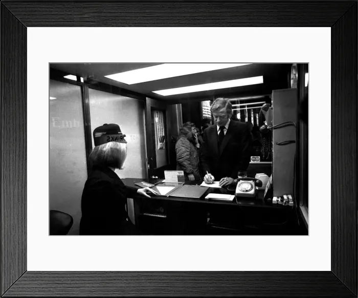 Framed Print : Film legend Michael Caine in Godrey Davies car hire office in Newcastle Central Station
