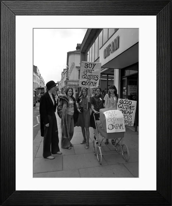 Framed Print : Shoppers in Leamington were treated to a fashion parade with a difference. Five members of Leamington's branch of Young Oxfam meddelled secon-hand clothing on sale at their shop in a fashion walkabout Framed Print : Shoppers in Leamington were treated to a fashion parade with a difference. Five members of Leamington's branch of Young Oxfam meddelled secon-hand clothing on sale at their shop in a fashion walkabout
