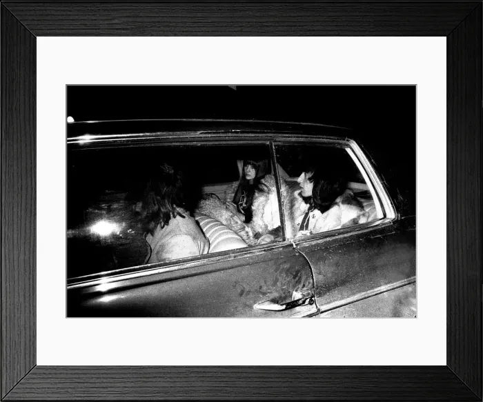 Framed Print : Rolling Stones Bill Wyman and his girlfriend Astrid leaving Newcastle station before
