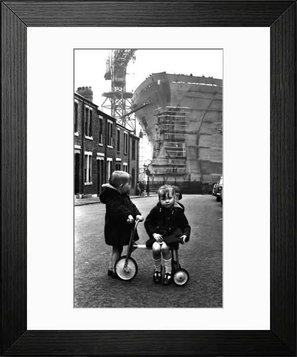 Framed Print : Children playing in the shadow of the giant 253, 000-ton oil tanker Esso Northumbria which Framed Print : Children playing in the shadow of the giant 253, 000-ton oil tanker Esso Northumbria which