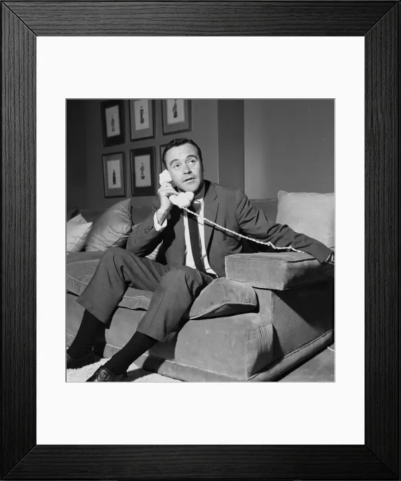 Framed Print : American actor Jack Lemmon on the telephone in his room at the Mayfair Hotel in London Framed Print : American actor Jack Lemmon on the telephone in his room at the Mayfair Hotel in London
