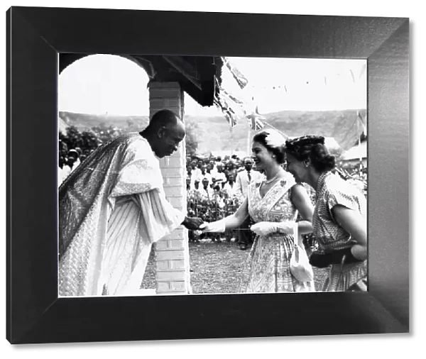 Queen Elizabeth II meets a miner at his home during her tour of the UDI siding housing