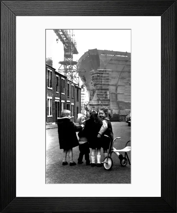 Framed Print : Children playing in the shadow of the giant 253, 000-ton oil tanker Esso Northumbria which Framed Print : Children playing in the shadow of the giant 253, 000-ton oil tanker Esso Northumbria which