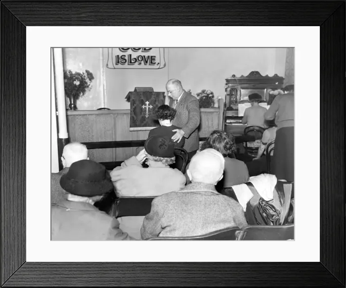 Framed Print : Faith healer Mr. Alexander Albert Lunn with a patient during one of his services in 1956