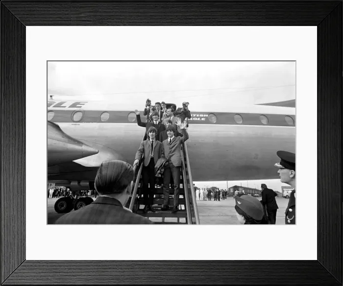 Framed Print : The Beatles pop group wave from the steps of the plane as they arrive in their hometown Framed Print : The Beatles pop group wave from the steps of the plane as they arrive in their hometown