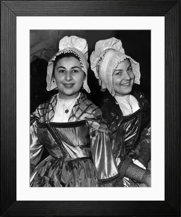 Framed Print : Two French dancing sisters in their traditional French costume Framed Print : Two French dancing sisters in their traditional French costume