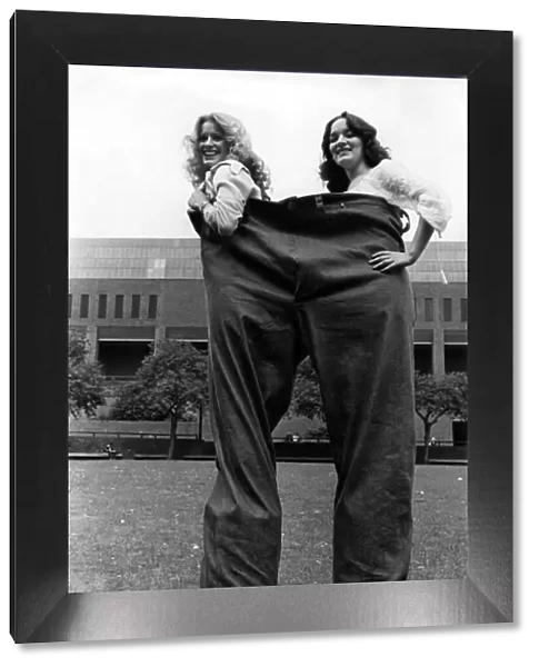 Model girls for a day, Gill Lowes, 22, and Debbie Raine, 17, in the 8ft long jumbo jeans