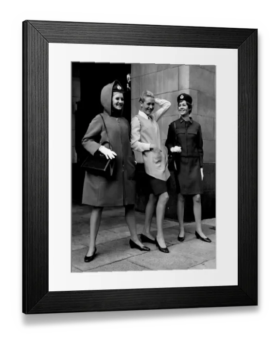 Framed Print : Three of the models (left) in the new bright red hooded coat zipped up to the neck Framed Print : Three of the models (left) in the new bright red hooded coat zipped up to the neck