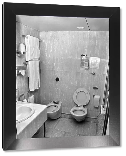 Interior view showing one of the cabin bathrooms aboard the luxury passenger liner QE2