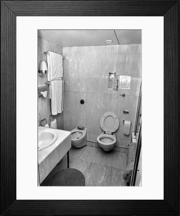 Framed Print : Interior view showing one of the cabin bathrooms aboard the luxury passenger liner QE2