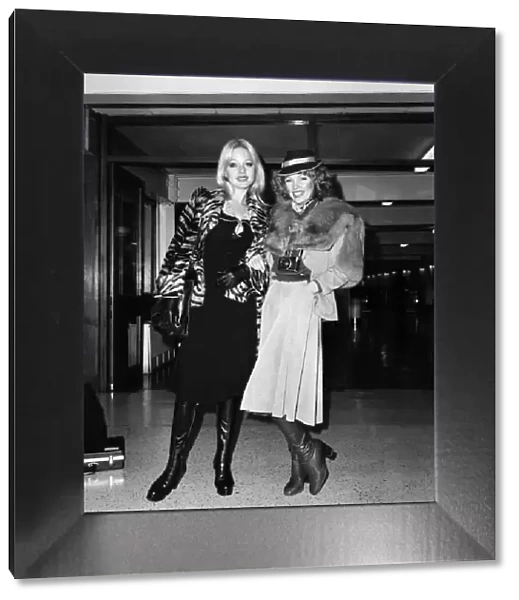 Models Lilian Muller (blonde) and Suze (in hat) leaving Heathrow Airport for Chicago
