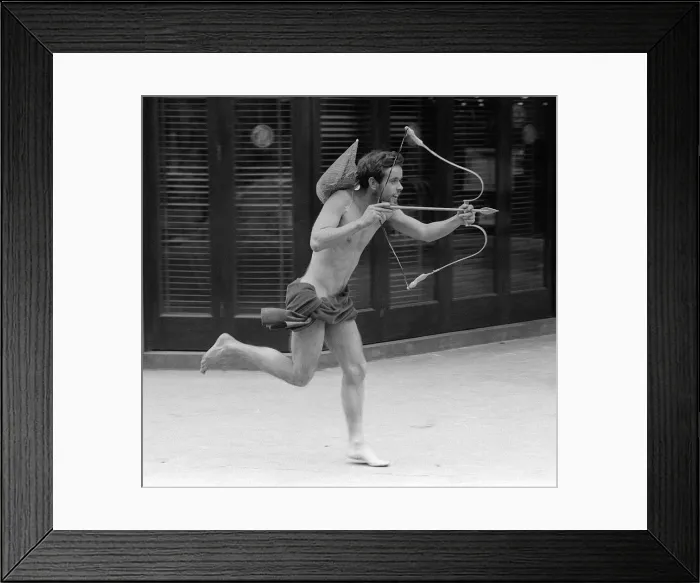 Framed Print : 22 year old Philip was dressed as Cupid in Piccadilly Circus in London for a charity