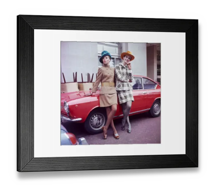 Framed Print : Sixties Fashion 1960s clothing Women with hats leaning on car