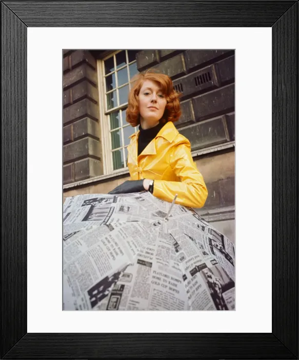 Framed Print : Beautician Kay Orr seen here modelling a bright yellow raincoat Framed Print : Beautician Kay Orr seen here modelling a bright yellow raincoat
