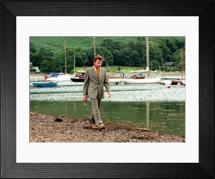 Framed Print : Ewan McGregor on th eIsle of Arran with bottle of Loch Ranza single malt whisky