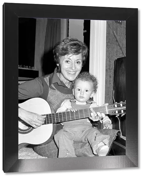 International singer star: Caterina Valente serenades her son. February 1975 75-00827