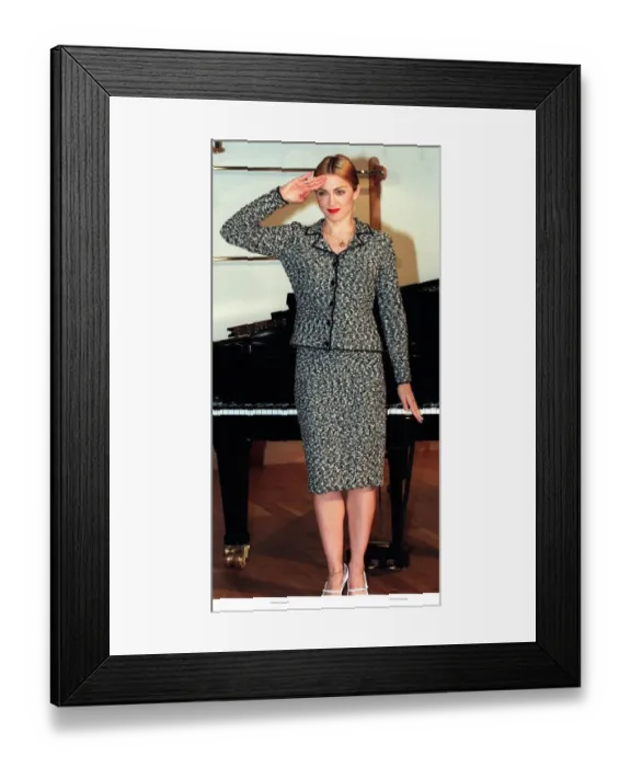 Framed Print : Madonna celebrating the news that she is to play the role of Evita In background Grand