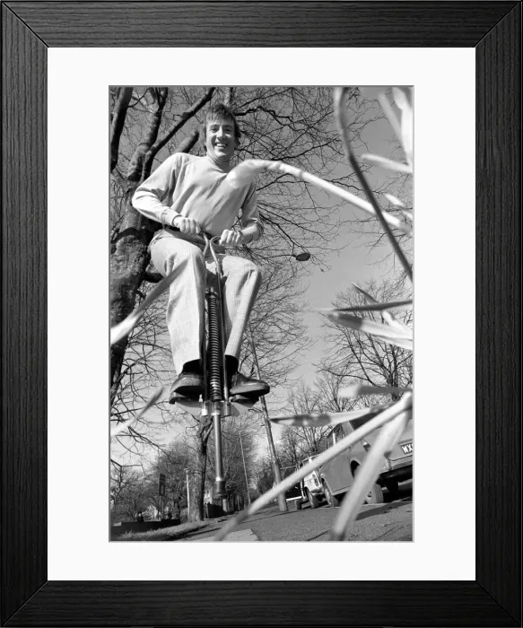 Framed Print : Roy Castle on a pogo stick. January 1975 75-00573 Framed Print : Roy Castle on a pogo stick. January 1975 75-00573