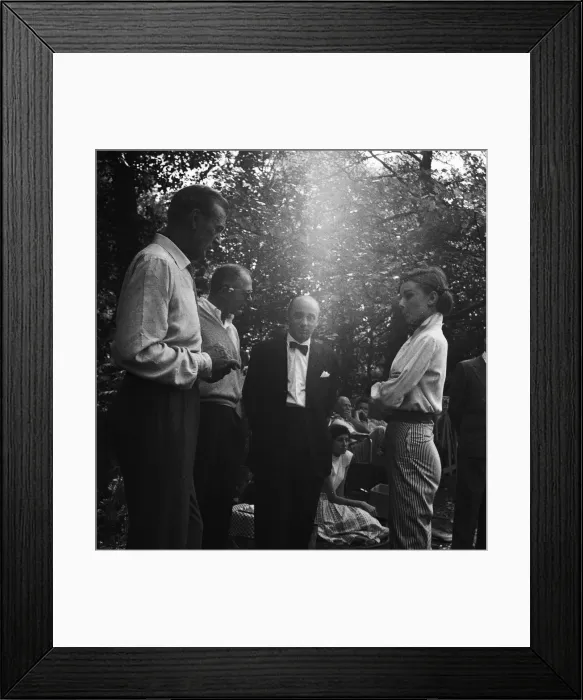 Framed Print : Gary Cooper and Audrey Hepburn making the film Love In the Afternoon 1956