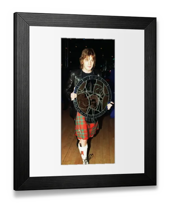 Framed Print : Ewan McGregor actor carrying award Scottish Peoples Film Festival 1997 round targe like