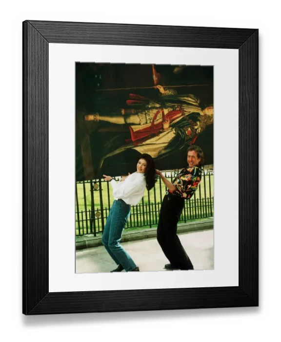 Framed Print : Eric Idle and Catherine Zeta Jones carrying painting 1993