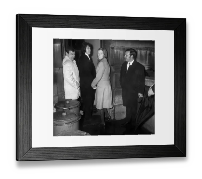 Framed Print : Beatle Paul, McCartney and his fiancee Linda Eastman arrives at a side door of Framed Print : Beatle Paul, McCartney and his fiancee Linda Eastman arrives at a side door of