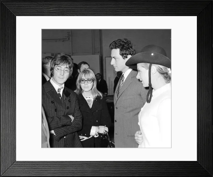 Framed Print : Beatles files 1967. John Lennon & Cynthia at London motor show talking to Framed Print : Beatles files 1967. John Lennon & Cynthia at London motor show talking to