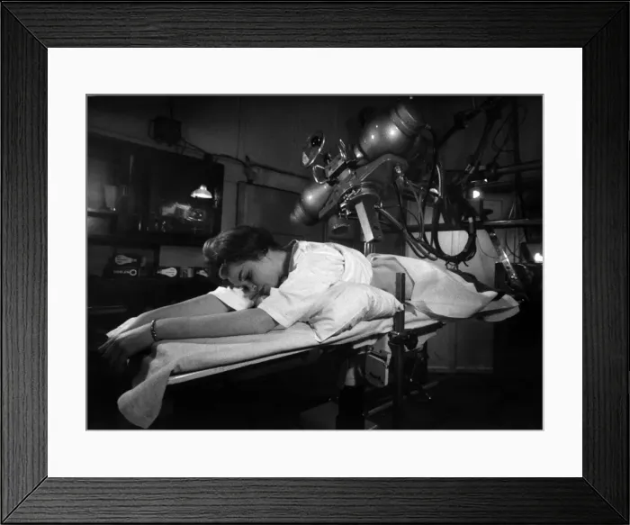 Framed Print : Woman undergoing a cancer check at an X ray unit in a London hospital