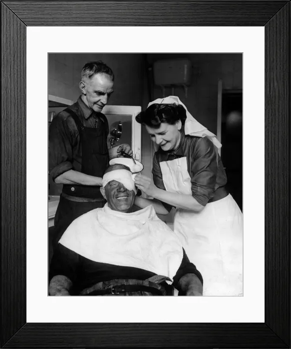 Framed Print : Sister Eira Davies, with help from ambulance man John Price Framed Print : Sister Eira Davies, with help from ambulance man John Price
