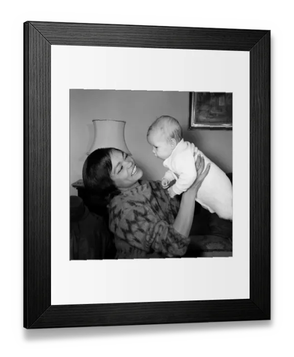 Framed Print : American singer and actress Eartha Kitt, photographed with her baby girl Kitt Framed Print : American singer and actress Eartha Kitt, photographed with her baby girl Kitt