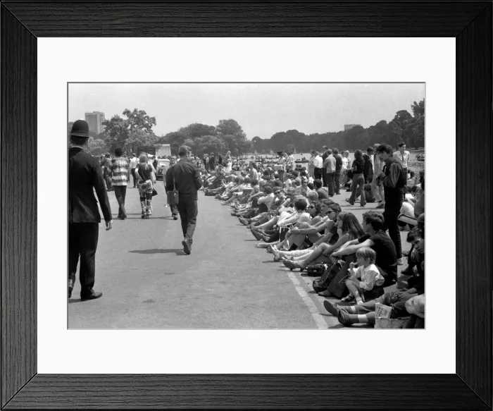Framed Print : Pop fans sitting down near the Serpentine at The Rolling Stones concert at Hyde Park Framed Print : Pop fans sitting down near the Serpentine at The Rolling Stones concert at Hyde Park
