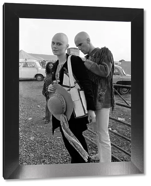 Shaven headed couple at The Isle of Wight Pop Festival. 30th August 1970