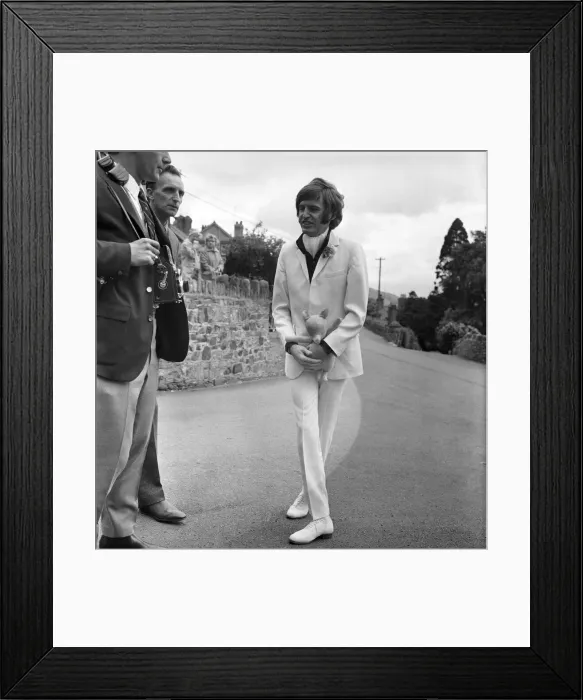 Framed Print : Mike McCartneys Wedding. Mike McGear with his doll on his way to church