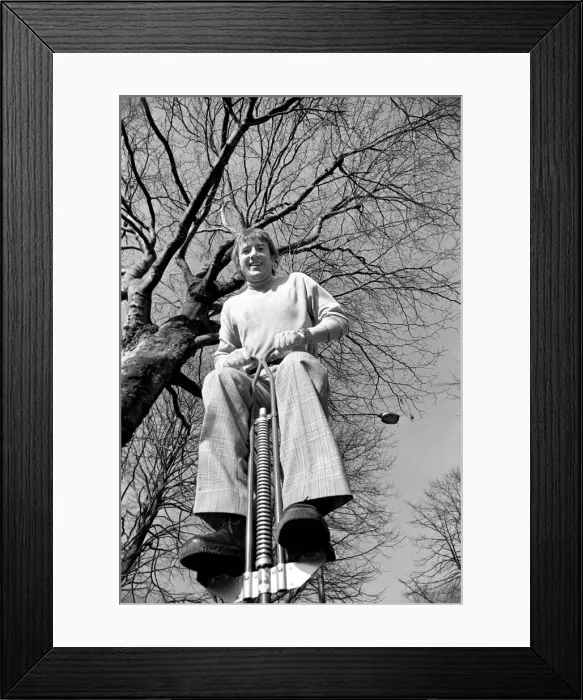 Framed Print : Roy Castle on a pogo stick. January 1975 75-00573-003 Framed Print : Roy Castle on a pogo stick. January 1975 75-00573-003