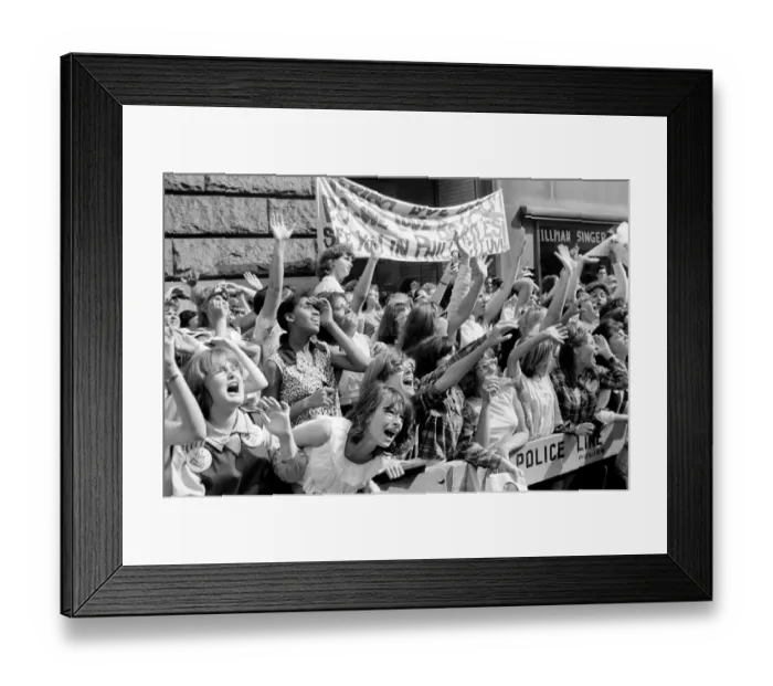 Framed Print : Screaming Beatles fans cheer for their idols on the streets of New York City