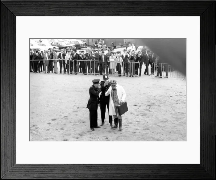 Framed Print : Peter Sellers in gas mask explaining to police (in the film Framed Print : Peter Sellers in gas mask explaining to police (in the film