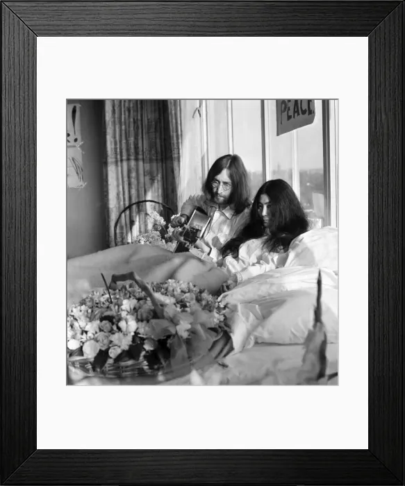 Framed Print : John Lennon and his wife Yoko Ono are having a weeks love-in their room at the Hilton
