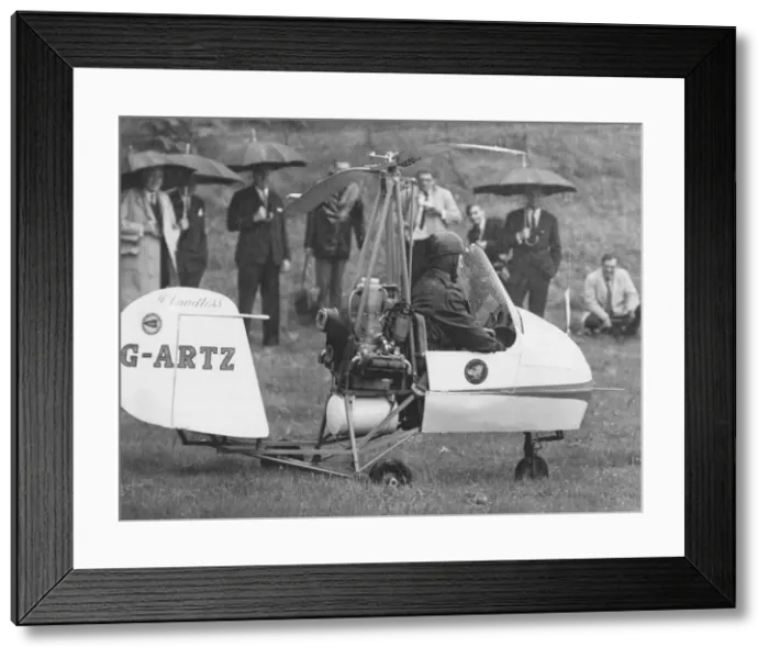 Framed Print : Watched by Prince Philip, autogyro pilot Rex McCandless begins his take-off in a field