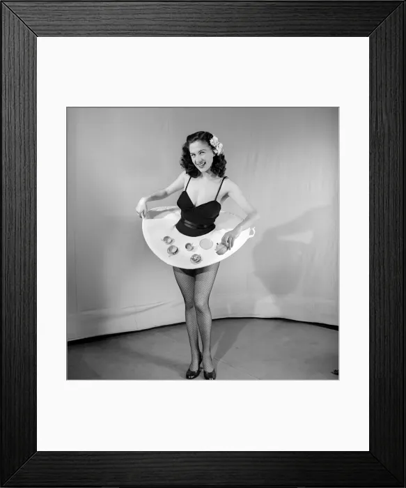 Framed Print : Tea for two: Woman wearing tea cup skirt. 1959 E38-004
