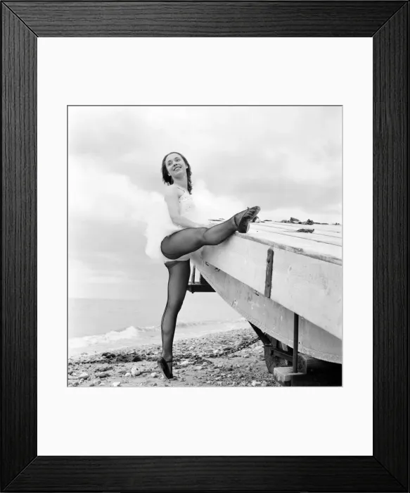 Framed Print : Ballerina Anne Youngmen seen here in a tutu practising her dance moves beside the sea Framed Print : Ballerina Anne Youngmen seen here in a tutu practising her dance moves beside the sea