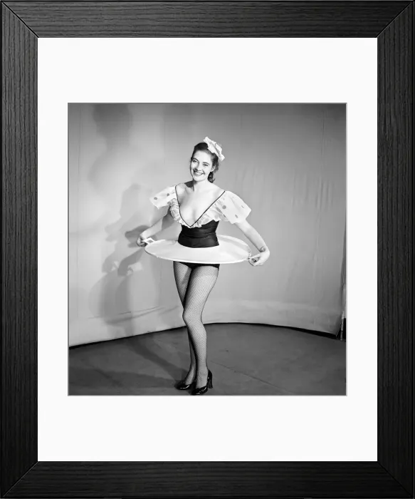 Framed Print : Woman wearing a skirt that is also a tray. 1959