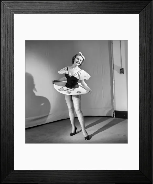 Framed Print : Tea for two: Clothing: Fashion: Skirt: Woman wearing skirt containing tea service