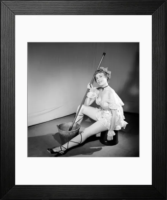 Framed Print : Cleaner wearing fancy dress. 1966 E25-004