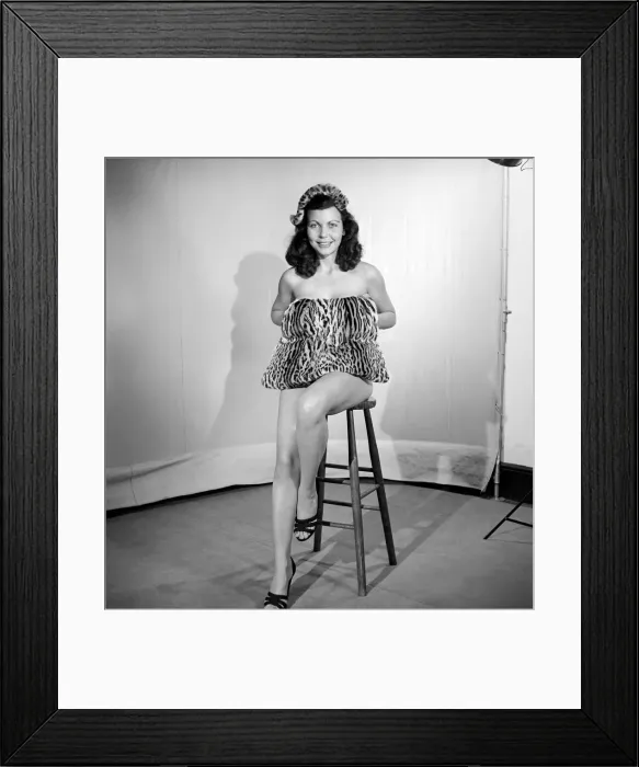 Framed Print : Model wearing leopard skin mini dress and matching muff. 1964 Framed Print : Model wearing leopard skin mini dress and matching muff. 1964