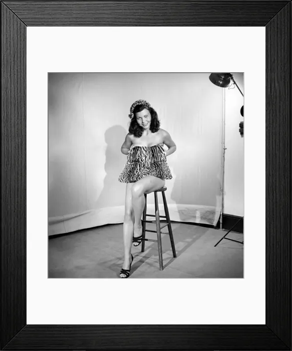 Framed Print : Model wearing leopard skin mini dress and matching muff. 1964 Framed Print : Model wearing leopard skin mini dress and matching muff. 1964