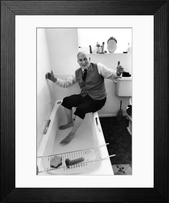 Framed Print : Ex pitman sixty nine year old Bill Newby celebrating getting a proper bath installed in