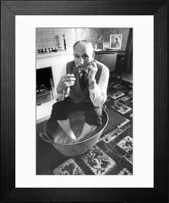 Framed Print : Ex pitman sixty nine year old bill Newby in his old tin bath which will be going out