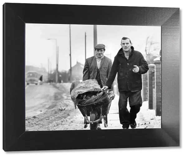 Miners Alf Wood and Raymond Varty delivering coal to the old and sick