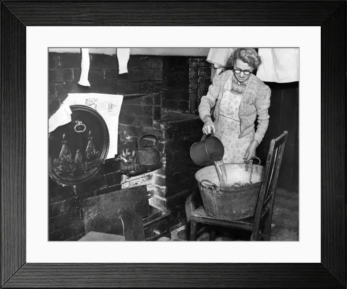 Framed Print : Mrs. L. Wilkinson prepares the bath for her miner sons at hartford Village