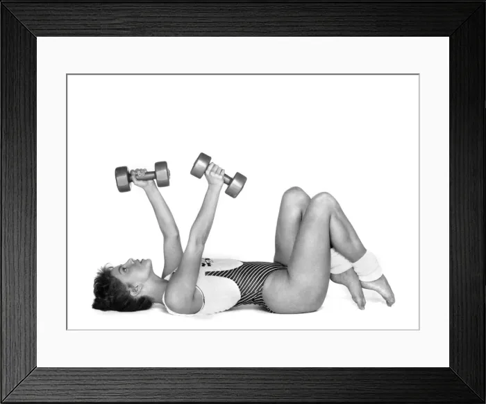 Framed Print : The Crunch. Lie on back, knees bent, feet flat. Hold weights with arms out Framed Print : The Crunch. Lie on back, knees bent, feet flat. Hold weights with arms out